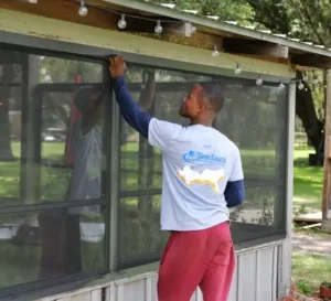 NewSouth Window Solutions installer replacing windows on a Florida home
